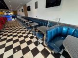 a black and white checkered floor in a diner