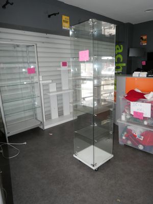 a glass display case in the middle of a store