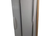 the refrigerator is in a cardboard box on a white surface