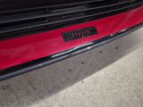 a close up of a car ' s bumper with a sticker on it