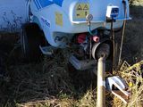 a white truck that has a blue and white tank on it