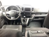 the interior of a car with a steering wheel and dashboard controls