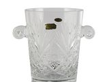 a clear glass vase with a gold coin in it
