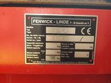 a picture of a red machine with a label on it