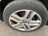 a close up of a tire on a car ' s rim