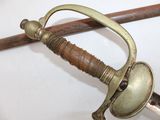 a close up of a sword with a handle on it
