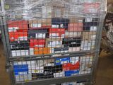 a metal cart with many boxes on it in a warehouse