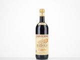 a bottle of wine sitting on top of a white table