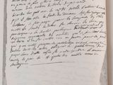 an open book with a handwritten letter on it sitting on top of a table