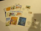 a lot of stamps that are on top of a refrigerator