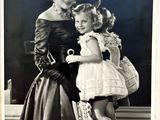 a black and white photo of a woman and a little girl