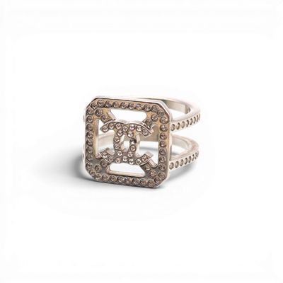 a close up of a ring with diamonds on a white background