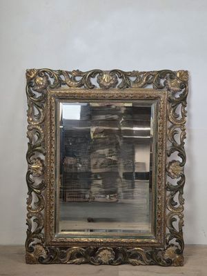 an image of a mirror sitting on top of a wooden floor