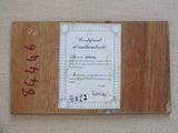 a picture of a certificate on a piece of wood