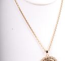 a close up of a necklace on a mannequin mannequin