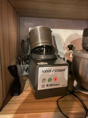 a picture of a mixer and a blender on a shelf