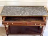 a small table with a marble top on it