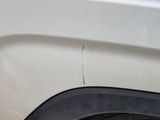 a close up of a car ' s front bumper and fender