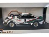 toy model of a white car in a white box with a green and red stripe