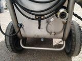 a white tank that has a hose attached to it