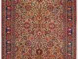 tapis persan ancien à motif floral sur fond rouge