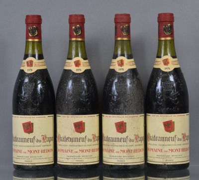 four bottles of wine are lined up on a table