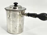 an old silver coffee pot with a wooden handle on a white background