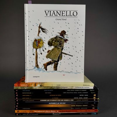 several books stacked on top of each other on a table