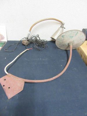 a picture of a table with a lamp and some other items