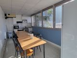 a room with a table and chairs in it