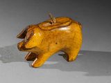 wooden figurine of an elephant with a saddle on it ' s back