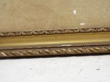 an image of a picture of a gold frame on a white surface