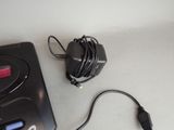 an image of a video game console and charger on a table