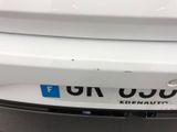 a close up of the rear bumper of a white car