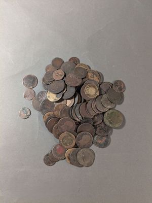 a pile of coins sitting on top of a table