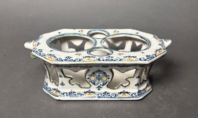 a small blue and white dish on a table
