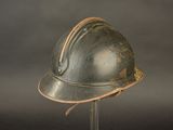 a helmet on a stand on a gray background