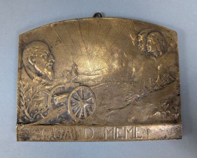an image of a metal plaque with an image of a man on a horse drawn carriage