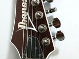 a close up of an electric guitar with a white background