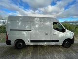 a white van that is parked on the side of the road