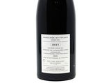 a bottle of wine that is sitting on a table