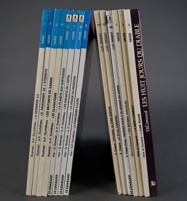 several books are stacked on top of each other on a table