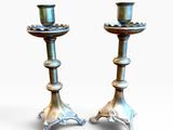 pair of antique silver candlesticks on cast iron bases