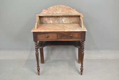 a small desk with a marble top and wooden legs
