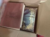 a book in a box with a tie in it
