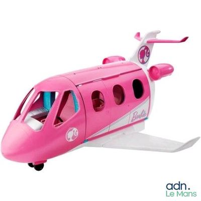 a pink toy airplane that is sitting on a white surface
