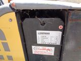 a close up of a parking meter with a sticker on it