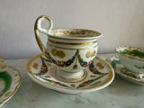 three cups and saucers sitting on a table next to each other