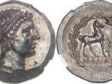 a close up of a coin with a woman and a horse on it