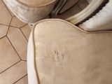 two couches that are sitting on a tiled floor